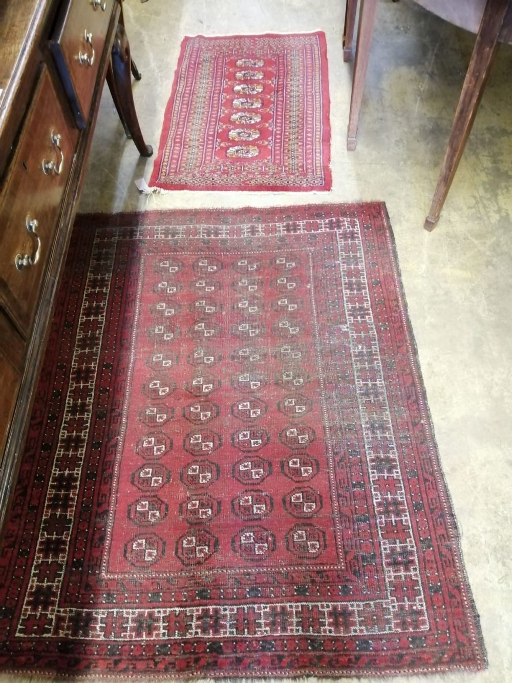 Two Afghan red ground rugs, largest 140 x 110cm